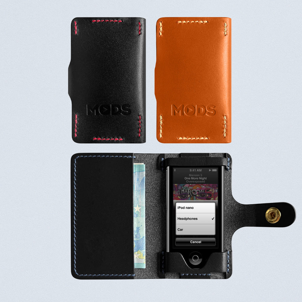 Black and brown phone cases with 'MODS' branding on a light gray background